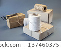 Cardboard boxes and packing twine, delivery concept. Stacking of postal cardboard boxes and packing twine. 137460375