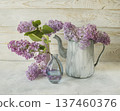 Fresh lilac flowers in a rustic jug, spring still life with lilac flowers on a light background. 137460376