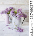 Fresh lilac flowers in a rustic jug, spring still life with lilac flowers on a light background. 137460377