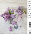 Fresh lilac flowers in a rustic jug, spring still life with lilac flowers on a light background. 137460378