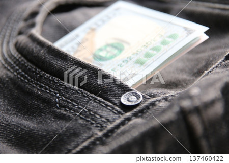American dollars USD banknotes in jeans pocket. American dollars USD banknotes in jeans pocket. 137460422