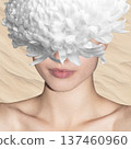 Woman with white chrysanthemum covering face surreal concept 137460960