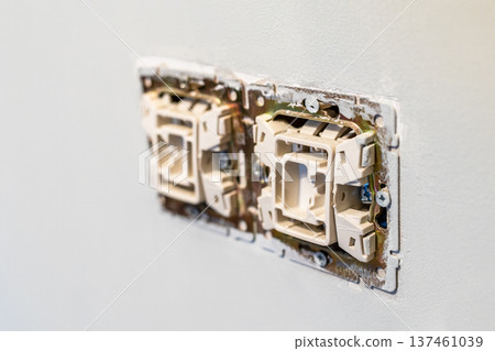 electrical switches closeup on painted wall 137461039