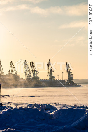 frozen coast and cranes in port of Kandalaksha 137461087