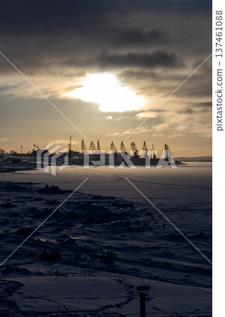 frozen sea shore and port cranes in Kandalaksha 137461088
