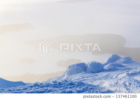 snowy cliff and view of Kandalaksha bay in haze snowy cliff and view of Kandalaksha bay in haze 137461100