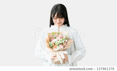 Smiling woman holding a bouquet of flowers, Mother's Day image Smiling woman holding a bouquet of flowers, Mother's Day image 137461178