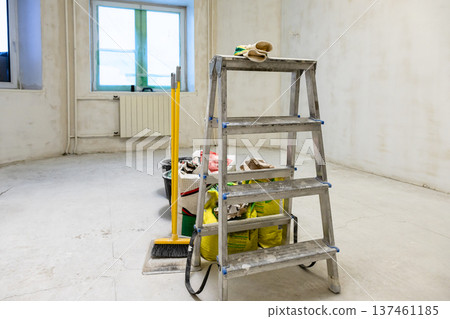 plasterer's tools in room with rough finishing plasterer's tools in room with rough finishing 137461185