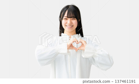 Smiling woman making a heart symbol Smiling woman making a heart symbol 137461191