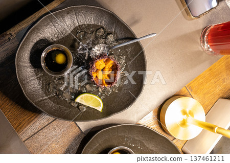 view of plate with sea urchin caviar, Murmansk view of plate with sea urchin caviar, Murmansk 137461211