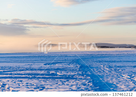 way on frozen Kandalaksha bay at winter sunrise way on frozen Kandalaksha bay at winter sunrise 137461212
