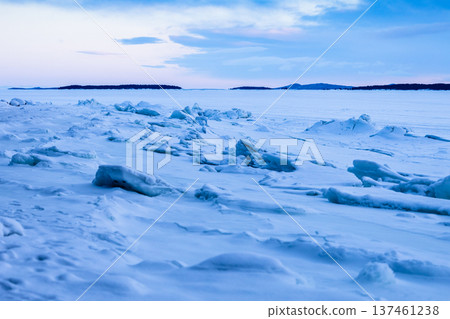snowy surface of Kandalaksha Bay in winter dusk 137461238
