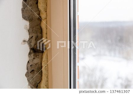 slit after installing plastic window frame slit after installing plastic window frame 137461307