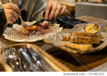 eating tartare with sea urchin caviar, Murmansk eating tartare with sea urchin caviar, Murmansk 137461337