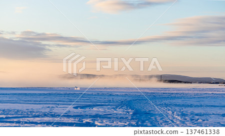 path on frozen Kandalaksha bay at winter sunrise path on frozen Kandalaksha bay at winter sunrise 137461338