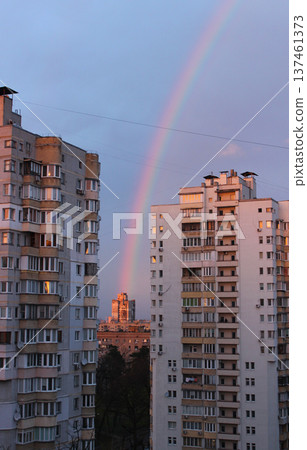 The rainbow seems to come from a residential building between two high-rise buildings 137461373