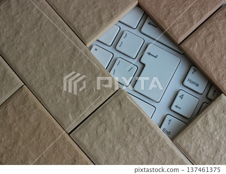 Part Of White Keypad Inside Decorative Brickwork. Stock Photo For Antivirus Illustration Part Of White Keypad Inside Decorative Brickwork. Stock Photo For Antivirus Illustration 137461375