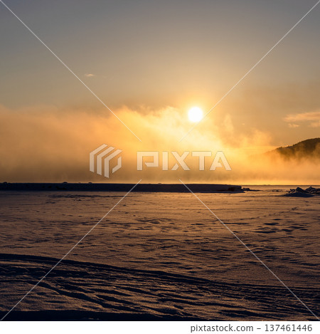 sunrise over frozen surface of Kandalaksha bay sunrise over frozen surface of Kandalaksha bay 137461446
