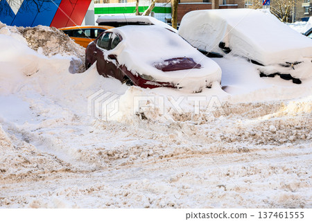 snow-covered car parking lots and snowy city road snow-covered car parking lots and snowy city road 137461555