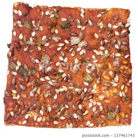 Crispy bread sprinkled with flax and sesame seeds, dried herbs, golden baked crust. Crispy bread sprinkled with flax and sesame seeds, dried herbs, golden baked crust. 137461743