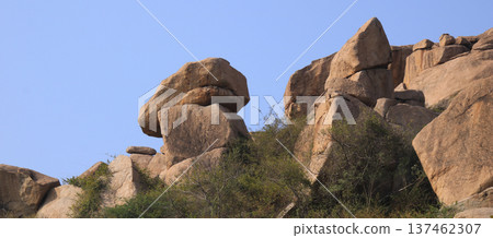 Big granite boulders in Basapur, Hampi, India. Big granite boulders in Basapur, Hampi, India. 137462307