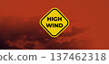 High Wind Watch Warning Yellow Caution Sign Floating Against Dramatic Red Orange Stormy Sky 137462318