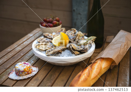 Fresh Raw Oysters with Citron, Baguette, Butter, and Cider Fresh Raw Oysters with Citron, Baguette, Butter, and Cider 137462513