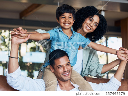 Smile, airplane and support with family on sofa for happy, bonding or peace on holiday. Love, care and playful with parents and child in living room at home for vacation, cuddle and embrace together Smile, airplane and support with family on sofa for happy, bonding or peace on holiday. Love, care and playful with parents and child in living room at home for vacation, cuddle and embrace together 137462679