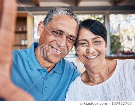 Selfie, happy and portrait of a senior couple bonding together at their modern house on a weekend. Smile, love and face of elderly man and woman in retirement taking a picture at their home in Mexico Selfie, happy and portrait of a senior couple bonding together at their modern house on a weekend. Smile, love and face of elderly man and woman in retirement taking a picture at their home in Mexico 137462793
