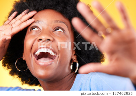 Face, happy and energy with a black woman closeup in studio on a yellow background for excitement. Wow, smile and surprise with a young afro person in celebration as a winner of a bonus or deal Face, happy and energy with a black woman closeup in studio on a yellow background for excitement. Wow, smile and surprise with a young afro person in celebration as a winner of a bonus or deal 137462925