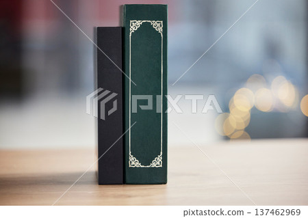 Books on table, mockup space and bokeh for religion, reading and study in faith education. Holy bible, desk and spiritual for learning, gospel knowledge and information to worship on a background Books on table, mockup space and bokeh for religion, reading and study in faith education. Holy bible, desk and spiritual for learning, gospel knowledge and information to worship on a background 137462969