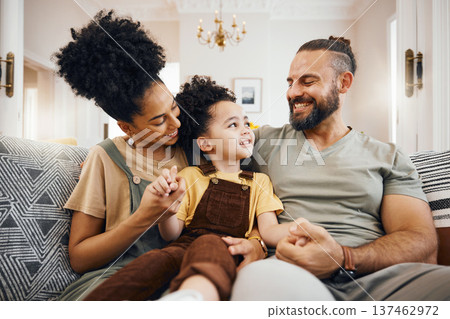 Smile, bonding and interracial family on the sofa for conversation, love and talking. Happy, house and a mother, father and a boy child on the couch for comfort, care and together for communication Smile, bonding and interracial family on the sofa for conversation, love and talking. Happy, house and a mother, father and a boy child on the couch for comfort, care and together for communication 137462972