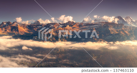 Panoramic aerial view of the Swiss Alps with snow-capped peaks 137463110