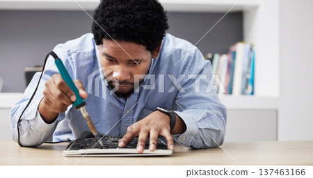 Black man, soldering iron and fixing circuit board, computer hardware and maintenance with electronics upgrade. Tools, motherboard and CPU, engineering and electric repair with technology in office 137463166