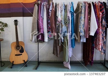 Fashion, retail and hipster clothes in store for shopping choice, decision and option in boutique. Designer, rack and display of clothing, material and textile products for sale, deal and discount 137463207