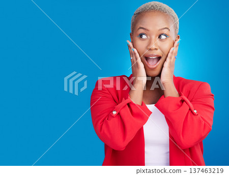 Hands on face, surprise and a woman in studio for wow advertising, marketing or announcement. Happy emoji of an excited African person on a blue background for news, mockup space or fashion promotion Hands on face, surprise and a woman in studio for wow advertising, marketing or announcement. Happy emoji of an excited African person on a blue background for news, mockup space or fashion promotion 137463219