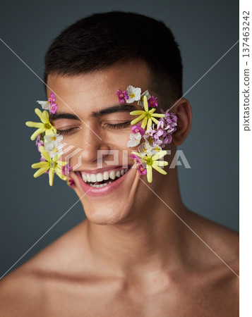 Face, happy man and flowers, beauty and nature, cosmetics and headshot with art deco isolated on studio background. Natural aesthetic, dermatology with eco friendly skincare and clean with spring 137463242