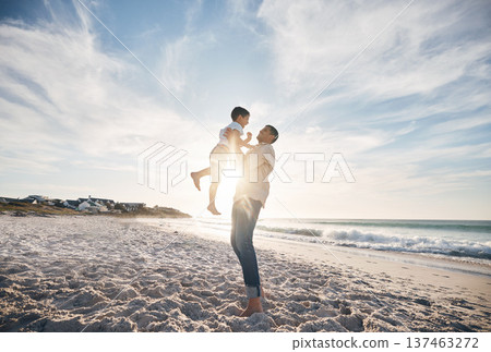Blue sky, father and child on beach, playing and bonding together on summer vacation in Hawaii. Sand, sun and ocean, dad and son with playful games on tropical island holiday with love, trust and fun Blue sky, father and child on beach, playing and bonding together on summer vacation in Hawaii. Sand, sun and ocean, dad and son with playful games on tropical island holiday with love, trust and fun 137463272