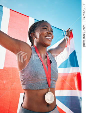 Exercise, winning and black woman with celebration, UK flag and sports with competition, achievement and champion. African person, athlete or winner with British symbol, pride and medal for victory Exercise, winning and black woman with celebration, UK flag and sports with competition, achievement and champion. African person, athlete or winner with British symbol, pride and medal for victory 137463297
