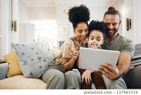Selfie, family and parents with a tablet, boy and connection with games, cartoon and streaming movies. Home, mother or father on a couch, child or kid with technology, relax or social media for fun Selfie, family and parents with a tablet, boy and connection with games, cartoon and streaming movies. Home, mother or father on a couch, child or kid with technology, relax or social media for fun 137463319