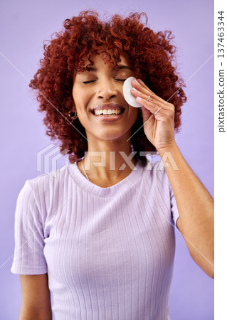 Skincare, cotton and happy woman in studio for cleaning, wellness or cosmetic on purple background. Beauty, smile and lady model with facial swab for toner, cleanse or face pad for makeup application Skincare, cotton and happy woman in studio for cleaning, wellness or cosmetic on purple background. Beauty, smile and lady model with facial swab for toner, cleanse or face pad for makeup application 137463344