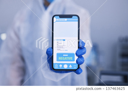 Hand, phone screen or qr code for monkeypox test results in science laboratory or healthcare hospital. Closeup, person or scientist and digital technology, virus or negative medical research feedback 137463625