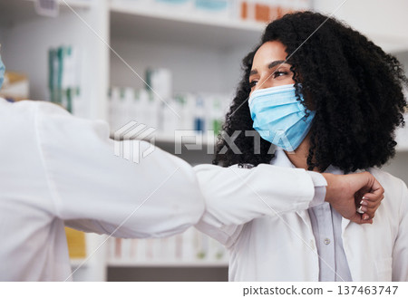Elbow greeting, face mask and doctors at a pharmacy for a hello, conversation or medical communication. Morning, nursing and people in healthcare with a handshake for safety from virus at a clinic 137463747