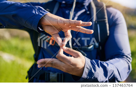 Closeup, hiking and a hand of a person in nature for fitness, training or a sign for exercise. Morning, mountain and an athlete with a gesture for travel, sports or cardio walking or trekking Closeup, hiking and a hand of a person in nature for fitness, training or a sign for exercise. Morning, mountain and an athlete with a gesture for travel, sports or cardio walking or trekking 137463764
