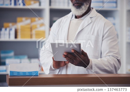 Hands, senior man and pharmacist with digital tablet for medicine inventory and pills database in pharmacy. Closeup, person and healthcare with internet technology for supply chain and research Hands, senior man and pharmacist with digital tablet for medicine inventory and pills database in pharmacy. Closeup, person and healthcare with internet technology for supply chain and research 137463773