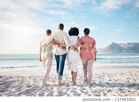 Back, hug and family at the beach for walking, travel or relax by the ocean on holiday. Together, care and parents with adult people at the sea during summer for a vacation, love or support in nature 137463802