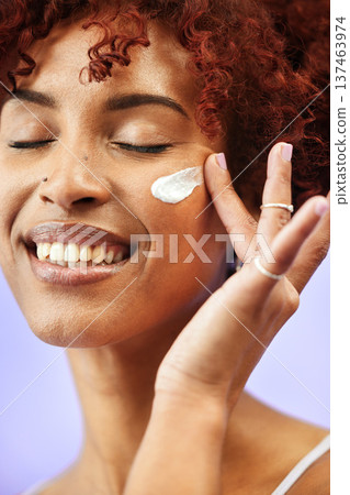 Beauty face, eyes closed and happy woman with cream application, melasma treatment or collagen skincare product. Hydration lotion, sunscreen and girl smile for studio acne creme on purple background Beauty face, eyes closed and happy woman with cream application, melasma treatment or collagen skincare product. Hydration lotion, sunscreen and girl smile for studio acne creme on purple background 137463974
