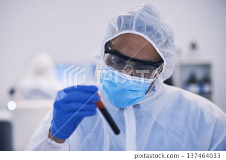 Scientist, blood test and face mask for vaccine, virus and healthcare research, tube and laboratory study. Medical worker, science doctor or man with focus for red, DNA liquid or covid 19 solution 137464033