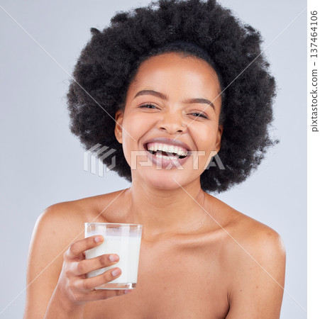 Happy woman, portrait and drink milk in studio for healthy skin, diet and calcium on white background. African model, dairy smoothie and glass of vanilla milkshake for nutrition, protein and beauty 137464106