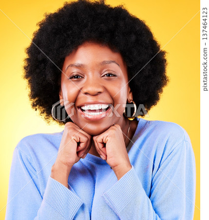 Portrait, smile and black woman hands on chin in studio, face and excited for skincare and cosmetics on yellow background. Happy, wellness and person with glow for aesthetic and natural beauty 137464123